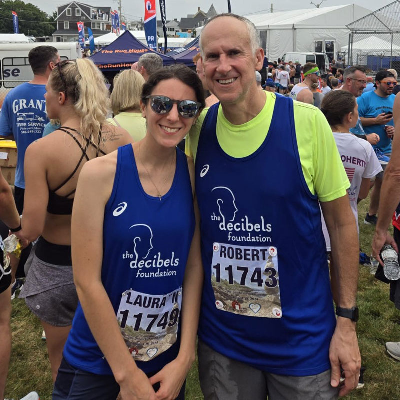 Female and male runners in Falmouth Road Race - Decibels Foundation